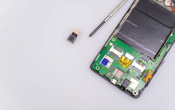 istock Repair the mobile phone on the white table copy space. 1308427410