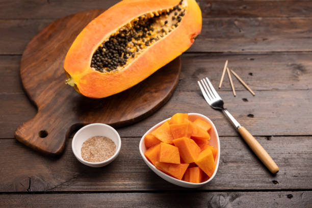 istock Sliced ripe papaya fruit on white plate ready to eat 1308428131