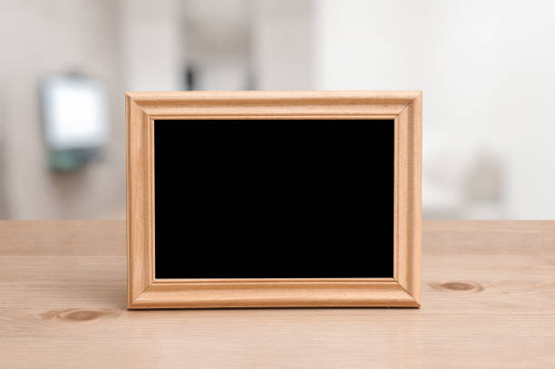 istock photo frame on the wooden table 1308428183
