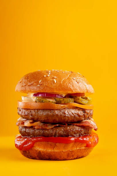 istock A delicious fresh burger with mushrooms and marinated cucumbers. 1308428326