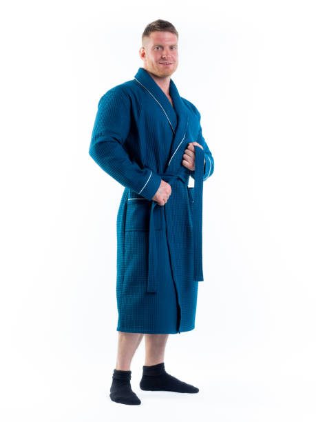 istock strong man in a Bathrobe on an isolated white background with a smile on his face. 1308429339