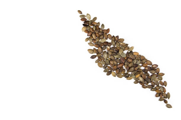 istock pumpkin seeds isolated on white background. top view 1308430430