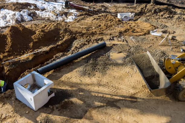 istock Installed construction of concrete pipe of drainage system work on the road for drained water sewer 1308431202