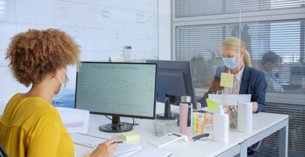 istock Businesswomen working on desktop pc in office 1308432264