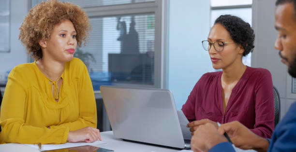 istock Business people talking with each other in office 1308432430