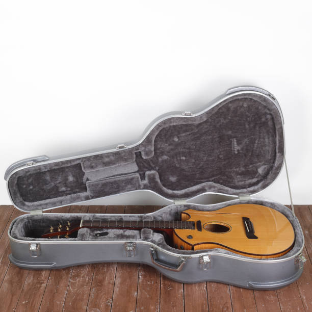 istock Musical instrument - Broken acoustic guitar in hard case 1308433771