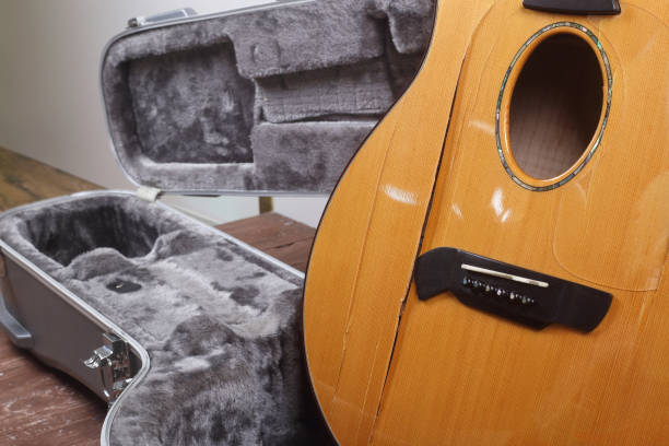 istock Musical instrument - Side view closeup fragment Broken acoustic guitar 1308433897