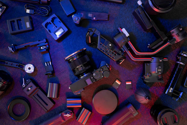 istock top view of work space photographer with digital camera, Gimbal Stabilizers and camera accessory 1308434112
