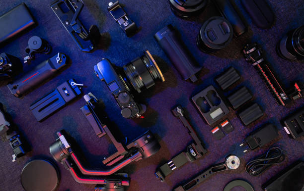 istock top view of work space photographer with digital camera, Gimbal Stabilizers and camera accessory 1308434129