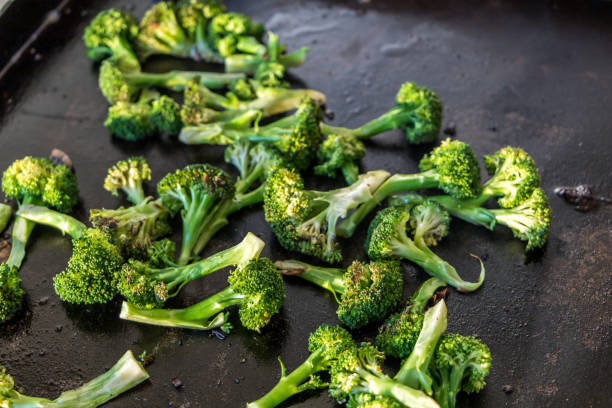 istock Grilled broccoli on a flat outdoor griddle 1308434463