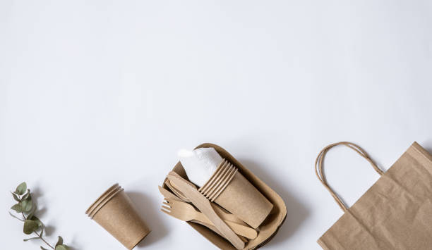 istock Composition with disposable paper dishes and cutlery copy space. 1308435591