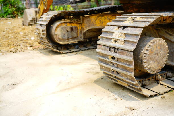 istock Tracks on a large excavator at a construction site 1308436103