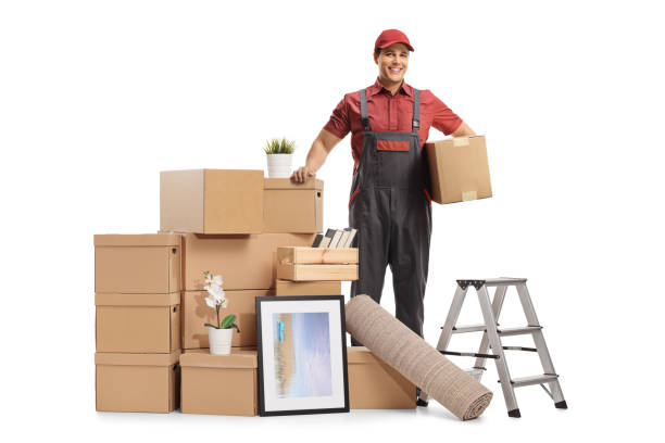istock Professional mover posing with a pile of packed cardboard boxes ready for removal 1308437058
