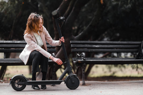 istock A young woman with electric scooter 1308438527