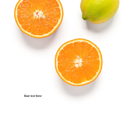 Half orange and lemon isolated on white background. Creative layout. Top view