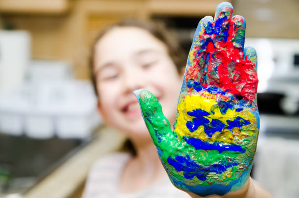 istock Girl showing her painted hand 1308441571