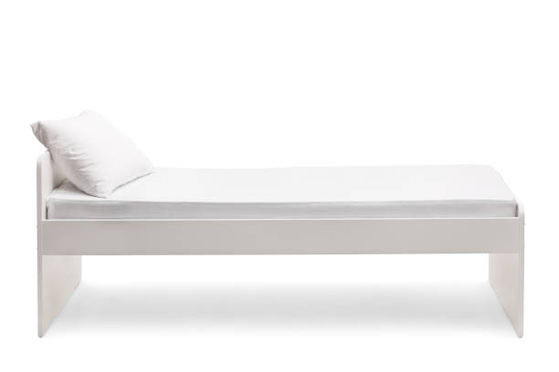 istock Studio shot of a single bed with a pillow 1308443160