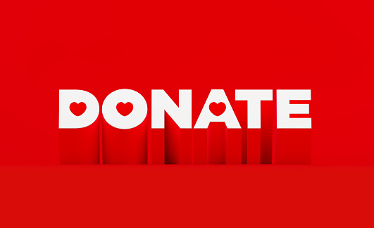 Donate text with heart shapes sitting on red background. Horizontal composition with copy space. Donation concept.