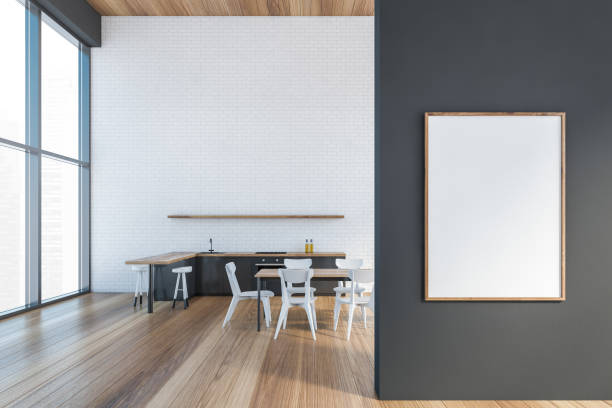 istock Modern kitchen interior with copy space on red brick wall, wooden countertops with a built in sink and a cooker. Mock up. Loft apartment dining room area. Front poster on grey wall. 1308446294