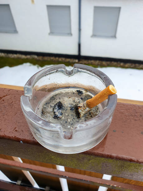 istock A stubbed out cigarette in an ashtray outside on the balcony. Stop smoking. 1308446667