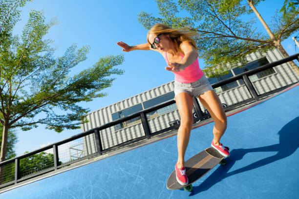 istock Young woman riding on surf skate 1308446798