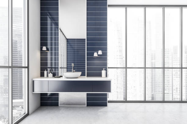 istock White and blue bathroom with one sink and mirror near window 1308448178
