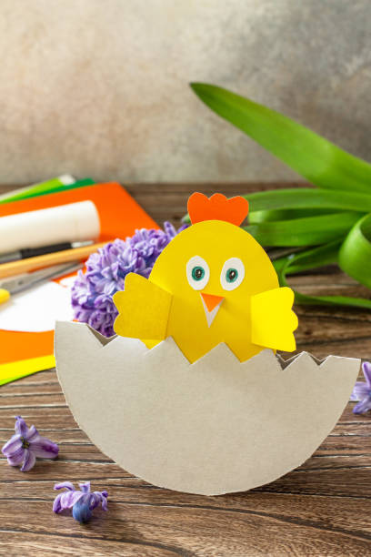 istock Paper Easter egg gift with a chicken. Easter handmade Project of children's creativity, handicrafts, crafts for kids. Copy space. 1308448569