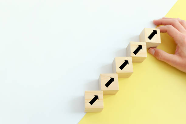 istock concept of growth success process. hand picking cube with arrow symbol 1308448779