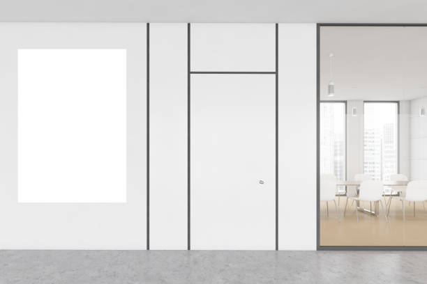 istock Mockup canvas and white conference room behind glass window, chairs and table 1308449819