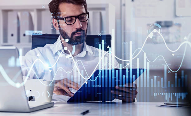 istock Businessman or stock trader analyzing stock graph chart by fibonacci indicator, side view business woman using laptop to buy or sell stock, double exposure graph, internet trading 1308451282