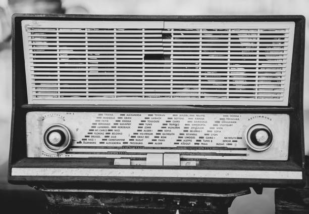 Close up of an old vintage radio receiver on a blurred background.