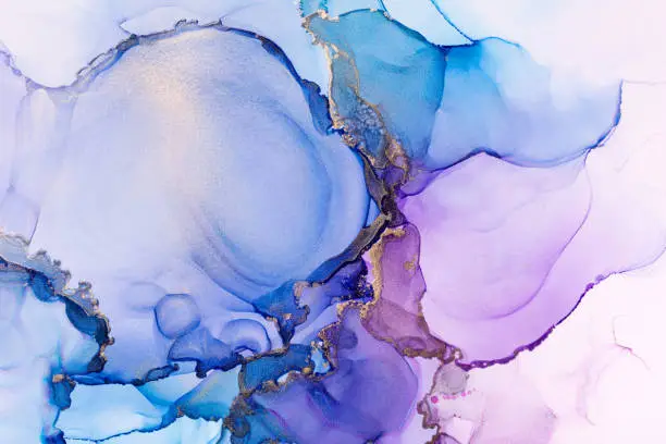 Photo of Purple, blue and shiny golden alcohol ink abstract texture