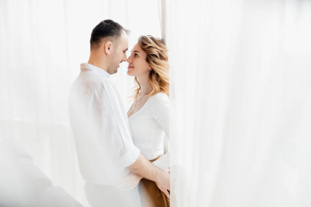 istock Loving everything about her. Beautiful young couple bonding and smiling. 1308453408