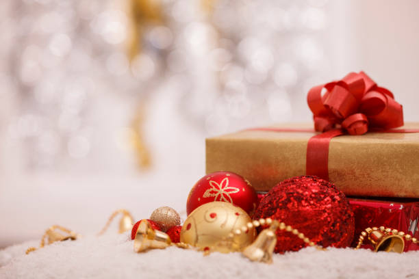 istock Sparkly Christmas ornaments with Christmas presents 1308453617