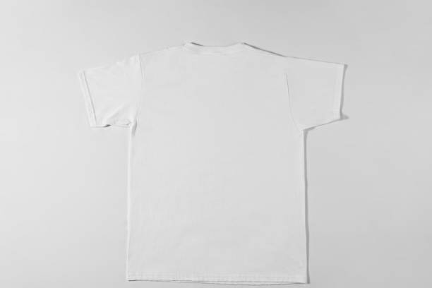 istock White cotton T-shirt lying on light background 1308454722