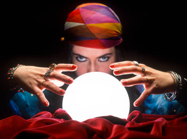 istock fortune teller with glowing crystal ball 1308454948