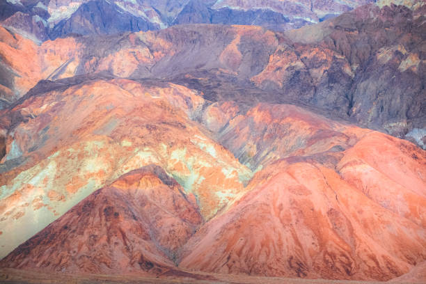 Pastel colour and  abstract texture of the otherworldly colourful volcanic rock terrain of the badlands landscape in Death Valley Park National Park, USA.