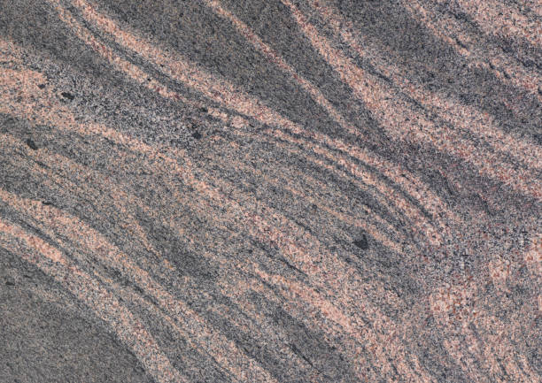 istock Marbled pattern of a smooth gray stone slab, natural stone cut and polished 1308456785