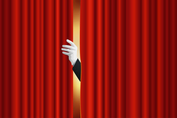 Opening the curtain of a stage show. Concept of show and entertainment, with a hand that opens the red curtain of a theater stage. stage curtain stock illustrations