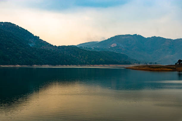 istock lake calm water with mountain background at day from flat angle 1308457577