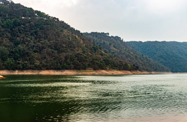 istock lake calm water with mountain background at day from flat angle 1308457691