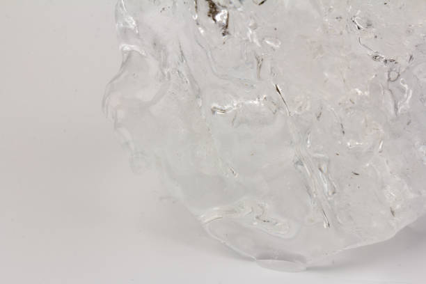 istock Real beautiful ice floe on light background. Cold winter ice texture. 1308459405