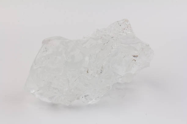istock Real beautiful ice floe on light background. Cold winter ice texture. 1308459437