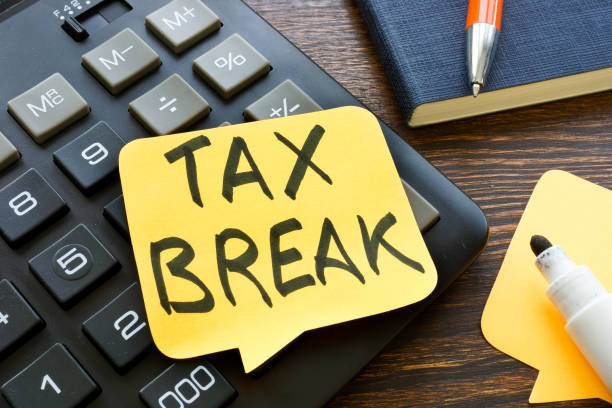 Sticky note that says tax break on a keyboard