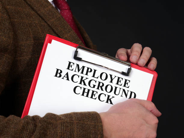 istock HR manager holds Employee background check report. 1308459552