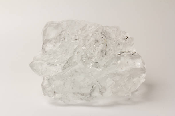 istock Real beautiful ice floe on light background. Cold winter ice texture. 1308459588