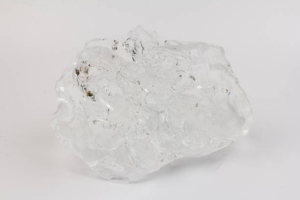 istock Real beautiful ice floe on light background. Cold winter ice texture. 1308459591