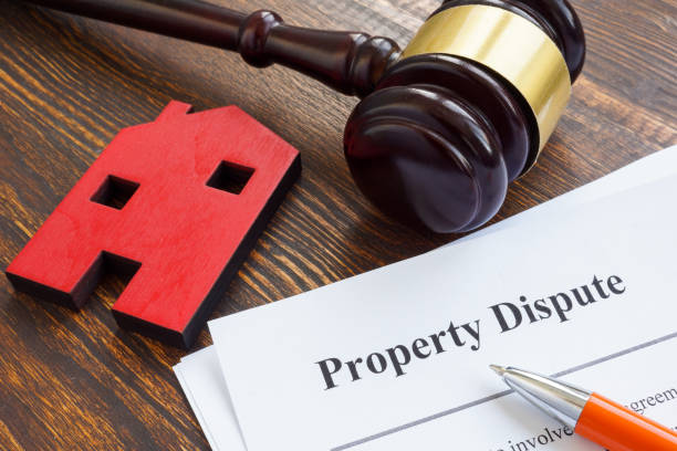 istock Property dispute documents, small home and gavel. 1308459622