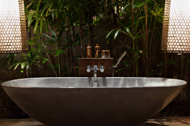 istock Bathroom on open air veranda with beautiful tropical garden view 1308459643