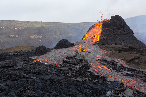 Geldingadalir, Iceland - March 21, 2021: A small volcanic eruption started at the Reykjanes peninsula. The event has attracted thousands of visitors who have braved a daring hike to the crater.